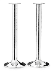 A pair of tall sterling silver candlesticks