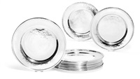A set of 12 sterling silver charger plates