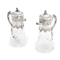 A near pair of French silver claret jugs
