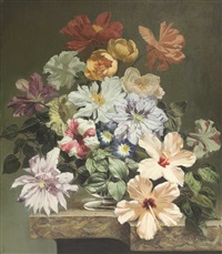 A still life of flowers in a glass vase on a ledge A still life of flowers in a glass vase on a ledge