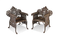 A pair of Indian wrought-iron openwork garden... A pair of Indian wrought-iron openwork garden...