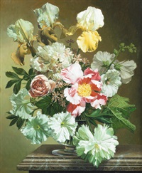 Still life of mixed flowers in a vase, on a... Still life of mixed flowers in a vase, on a...