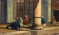 Figures at prayer inside a mosque