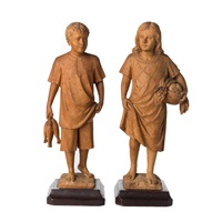 A pair of sculptures of a boy and a girl