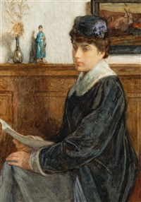 Seated young woman holding a letter
