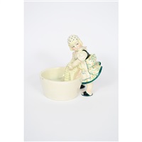 A young Italian girl washing clothes in a large... A young Italian girl washing clothes in a large...