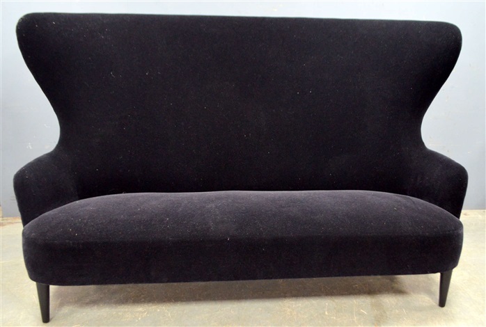 High Wing Back Sofa On Ebonised Legs By Tom Dixon Artnet High Wing Back Sofa On Ebonised Legs By Tom Dixon