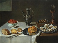 A dish of mussels with a bowl of butter resting... A dish of mussels with a bowl of butter resting...