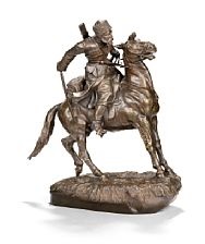 Russian gilt bronze sculpture with a cossack on... Russian gilt bronze sculpture with a cossack on...