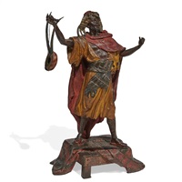 Orientalist large figural sculpture holding a... Orientalist large figural sculpture holding a...