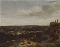 An extensive dune landscape with a woman resting An extensive dune landscape with a woman resting