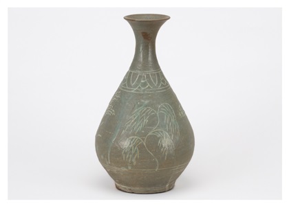 a large bottle with impressed and inlaid willow patterns