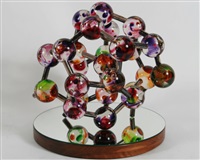 Free form sculpture comprised of mottled spheres Free form sculpture comprised of mottled spheres