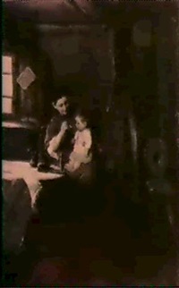 A PEASANTMOTHER FEEDING A CHILD IN A COTTAGE...