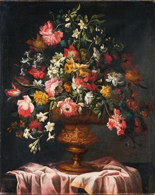 Flowers In An Ornamental Vase On A Table Covered By A Cloth By