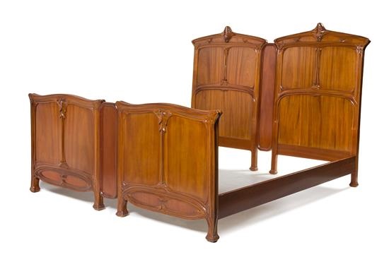 A Bedroom Set Comprising An Armoire Separated Into Two