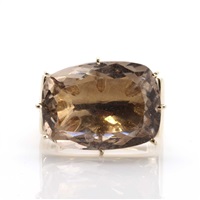A smoky quartz diamond and sapphire ring