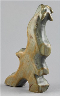 a grey and brown carving of an Abstract Bird a grey and brown carving of an Abstract Bird