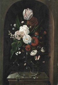 parrot tulips, roses and other flowers in a glass vase, with a butterfly, on a stone plinth in a niche by hans bollongier