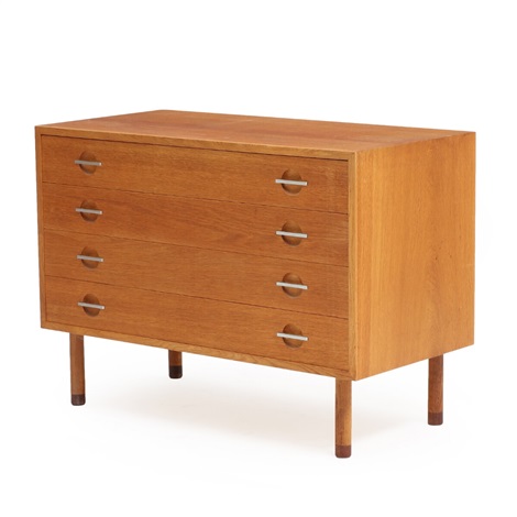 An Oak Chest Of Drawers With Steel Handles Front With Four