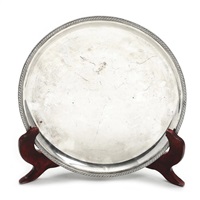 A circular sterling silver dish with..., 1952
