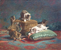Kittens playing with a sewing kit