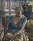 Portrait of seated woman with tea cup in hand