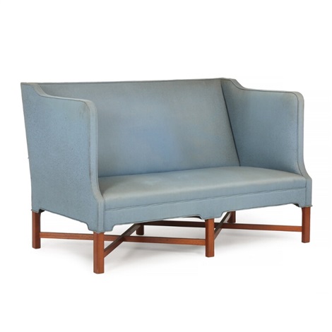 freestanding two seater sofa with profiled cross legged frame of