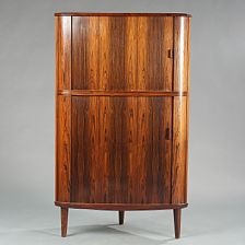 A Brazilian Rosewood Corner Cabinet With Two Sliding Doors In