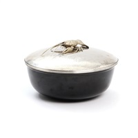 A German faience fish tureen with hammered... A German faience fish tureen with hammered...