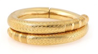 A bangle of 14k gold chased in Nordic style., 1900