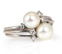 A pearl and diamond ring