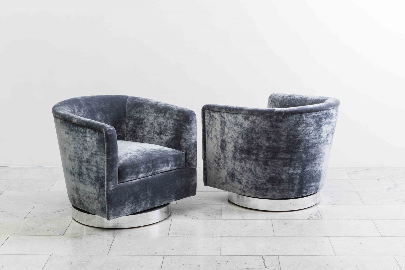 pair of dark grey swivel chairs by milo baughman on artnet