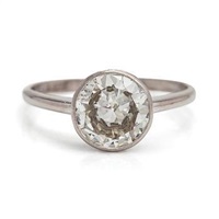 An 18K white gold ring with a brilliant-cut..., 1976 An 18K white gold ring with a brilliant-cut..., 1976