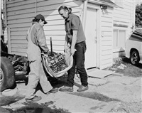 Men move an engine block, 2008