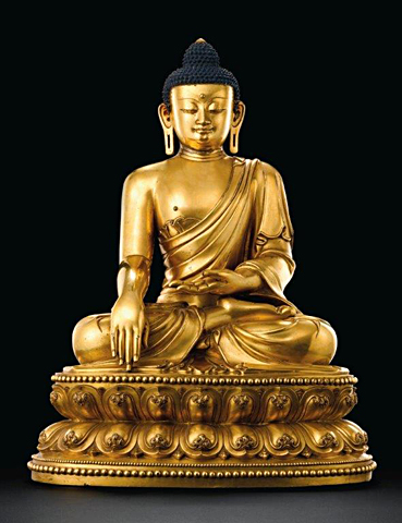 An outstanding and highly important massive gilt-bronze figure of a seated Shakyamuni Buddha An outstanding and highly important massive gilt-bronze figure of a seated Shakyamuni Buddha