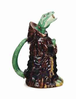 A Portugese Majolica Ewer Modeled As A Lizard In A Monk's Robes A Portugese Majolica Ewer Modeled As A Lizard In A Monk's Robes