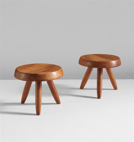 Pair of low tripod stools by Charlotte Perriand on artnet