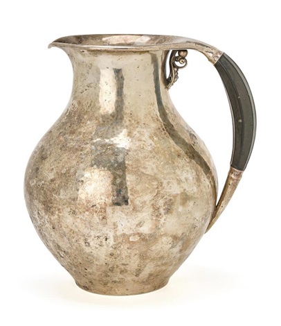 A sterling silver pitcher with hammered surface by Jörgen Jensen