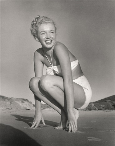 Marilyn Monroe on the beach in white bikini by André de Dienes on
